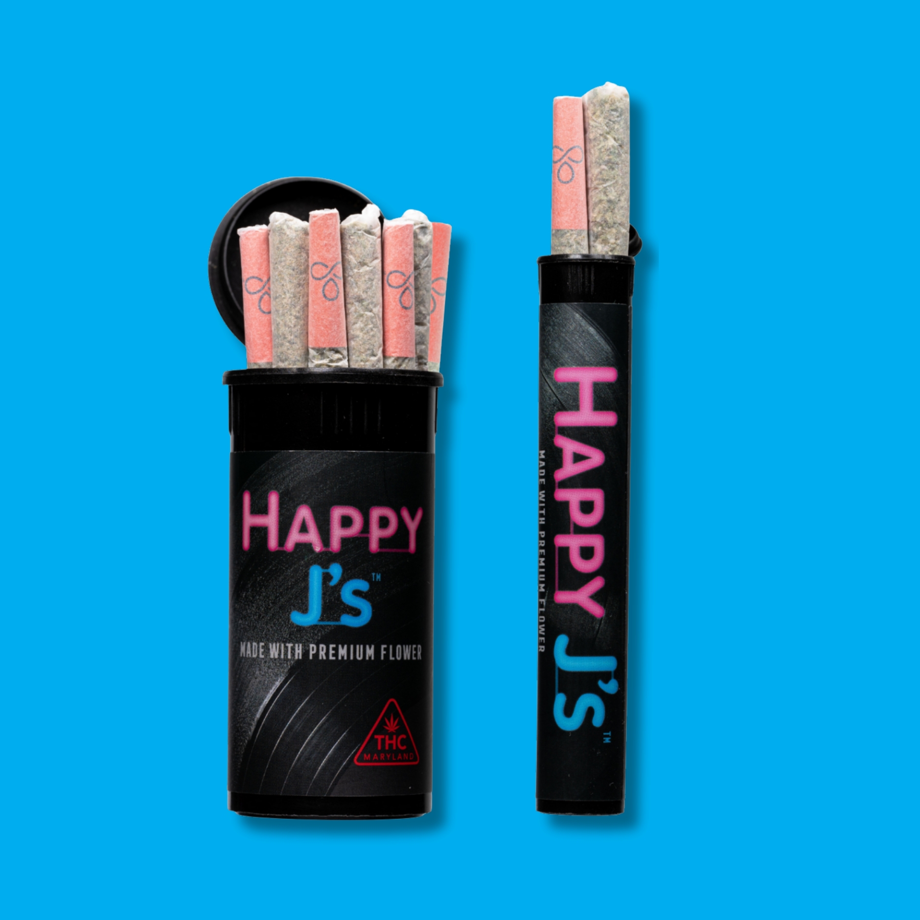 A black pop-top container labeled “Happy J’s – Made with Premium Flower” with the lid open, showing seven pre-rolled joints with pink filters standing upright. The label features neon pink and blue lettering and a red THC Maryland symbol with a blue background.