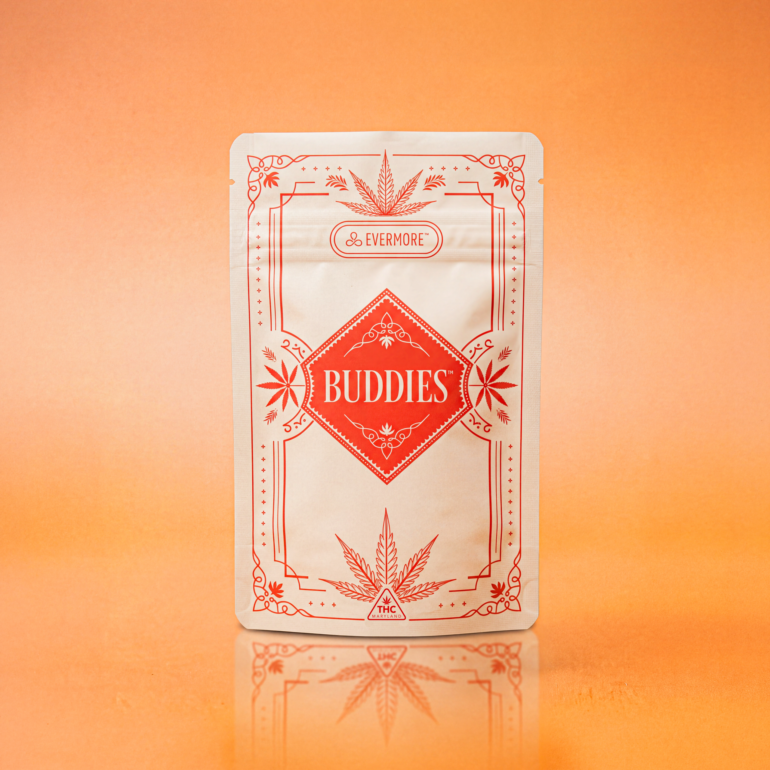 A white Evermore "Buddies" cannabis pouch with red line-art framing, standing upright against an orange background.