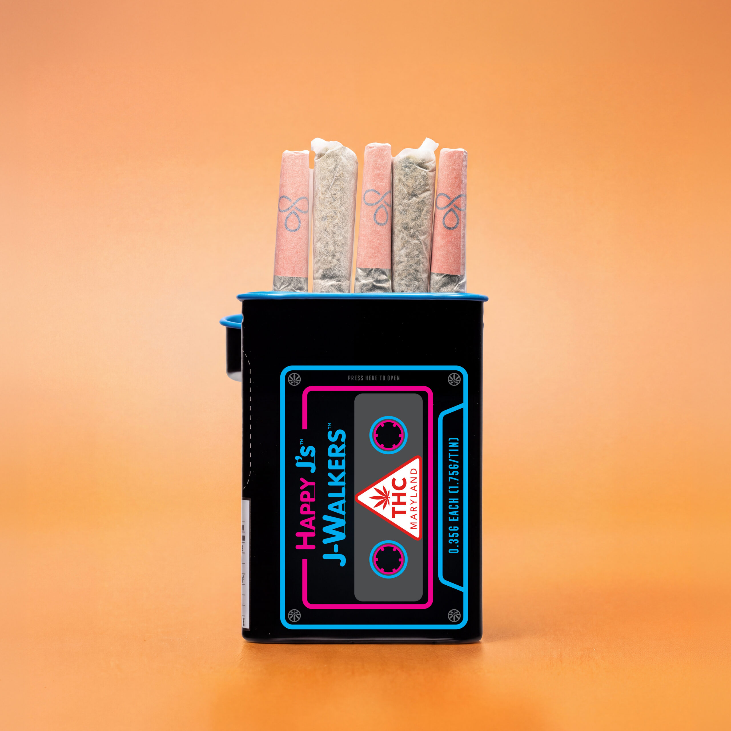 Black Happy J’s J-WALKERS pre-roll tin with blue and pink cassette tape graphics, holding five pre-rolls against a solid orange background.